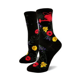 women's black crew socks feature red, yellow, and purple flowers and a red watering can pattern, perfect for the gardening enthusiast.   