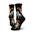 A pair of black crew socks with a repeating pattern of brown and white horses. The horses are depicted in a stylized, slightly whimsical manner.