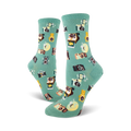 A pair of teal crew socks adorned with a whimsical pattern of retro cameras, film canisters, and sparkling details.
