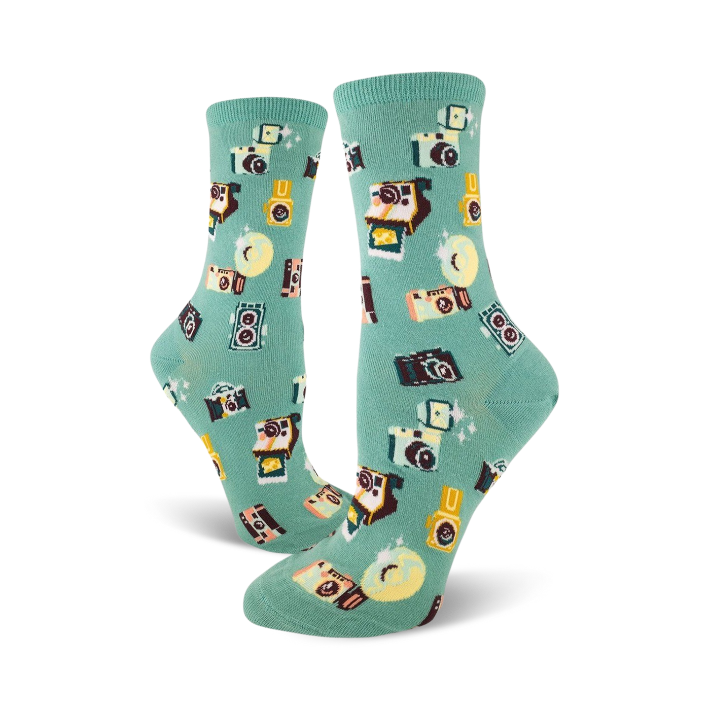 A pair of teal crew socks adorned with a whimsical pattern of retro cameras, film canisters, and sparkling details.