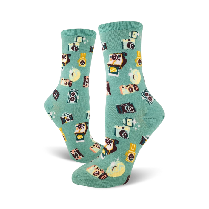 women's crew socks in mint green with vintage camera pattern in brown, black, yellow.  }}