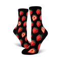 Close-up view of black crew socks with a red strawberry pattern. The socks are folded and displayed against a white background.