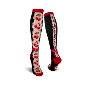 women's knee high socks with a red cherry and cream lace pattern, red bow at top.  