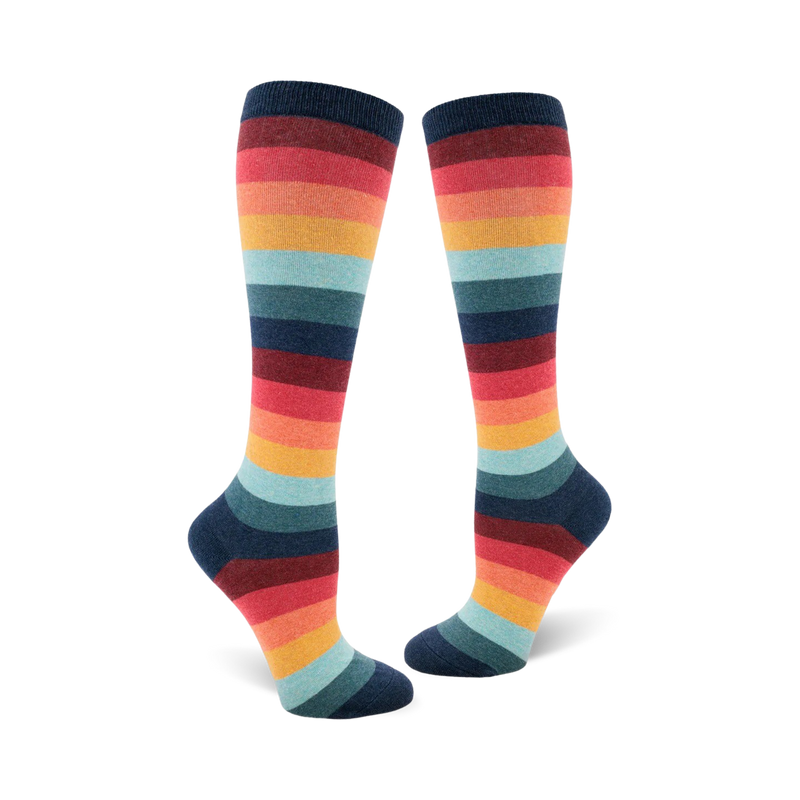 Pair of women's knee-high socks in a retro rainbow stripe pattern. Colors include teal, orange, red, and dark blue.