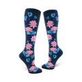 Pair of navy blue knee-high socks with a pattern of pink and teal lotus flowers and leaves.