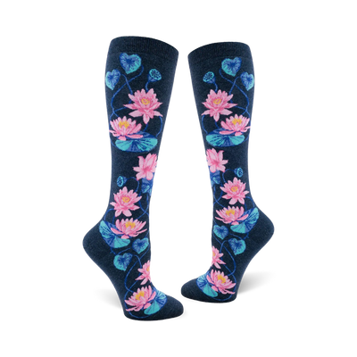Pair of navy blue knee-high socks with a pattern of pink and teal lotus flowers and leaves.