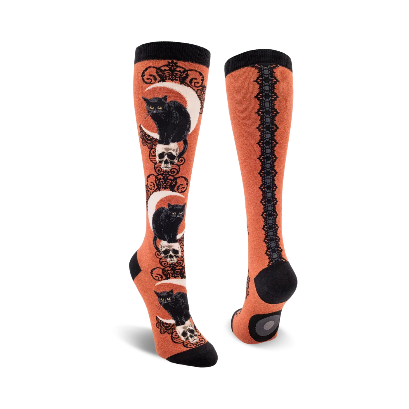 Pair of knee-high socks; orange and black, purple and black. Design features black cats sitting on skulls beneath crescent moons.