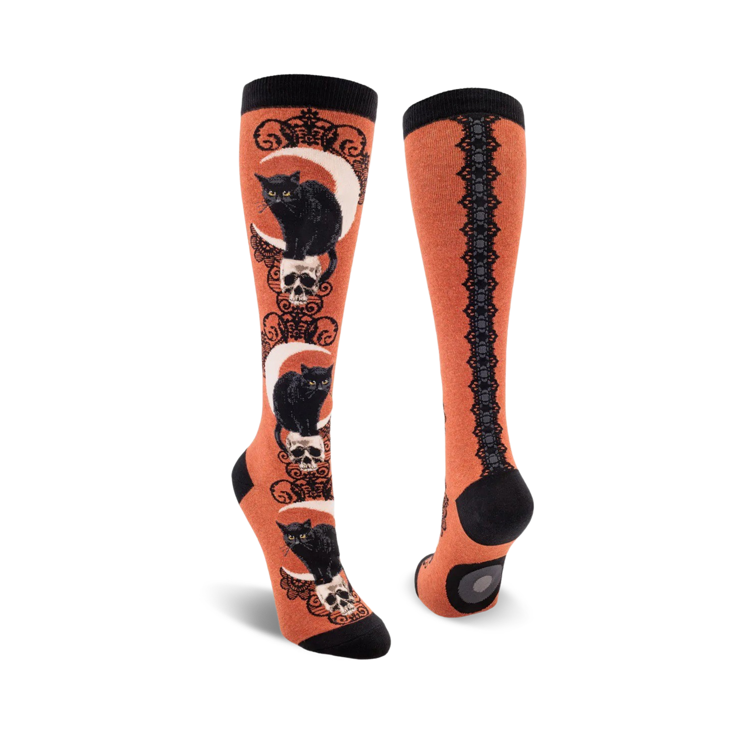 Pair of knee-high socks; orange and black, purple and black. Design features black cats sitting on skulls beneath crescent moons.