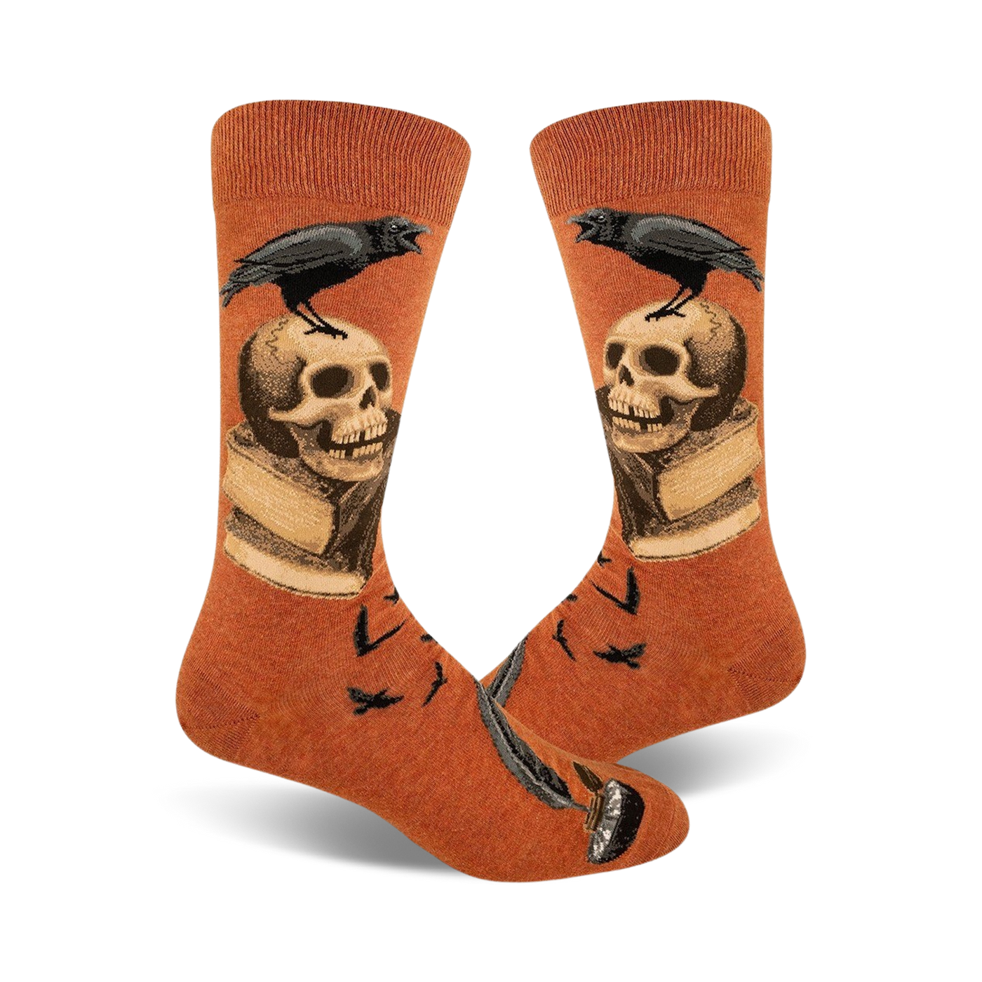 Pair of burnt orange crew socks.  A black raven perches on a skull resting on an open book, with a quill pen at the bottom.  Small ravens also in the background.