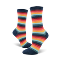 Pair of women's crew socks in a retro rainbow stripe pattern.  Colors include teal, orange, red, and dark blue.