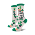 Cream crew socks with green cuffs. Feature various potted plants and the phrase 'F*ck people, I prefer plants'.