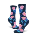 A pair of women's crew socks in navy blue, decorated with a pattern of pink and teal water lilies and leaves.