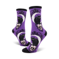 Lifestyle shot showing the purple Black Cat Moon socks on a model's feet.