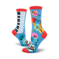 A pair of blue crew socks with a jazz band theme. One sock shows a piano keyboard, the other features musical instruments like a trombone, trumpet, and double bass.