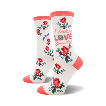 white crew socks with a repeating pattern of red roses and blue flowers. text on each sock reads "i fucking love swearing."   