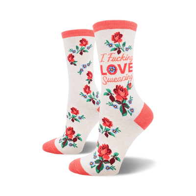 white crew socks with a repeating pattern of red roses and blue flowers. text on each sock reads "i fucking love swearing."   