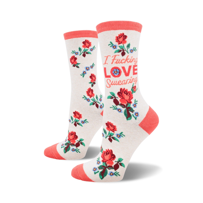 white crew socks with a repeating pattern of red roses and blue flowers. text on each sock reads 