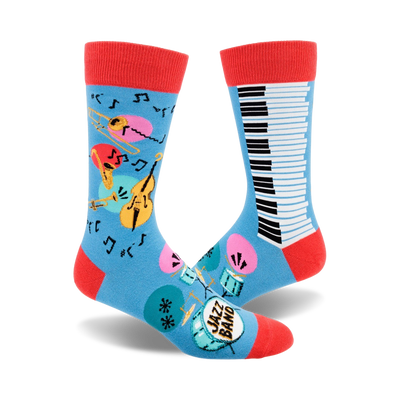 blue crew socks with musical instruments design, including saxophone, trumpet, drums, maracas, double bass, piano keys, and musical notes.  