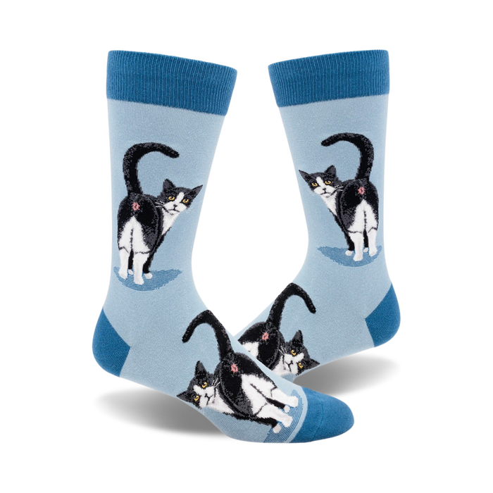 light blue crew socks for men featuring a pattern of black and white tuxedo cat butts.  