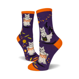 front view of a pair of purple socks with white cats dressed as ghosts trick-or-treating.