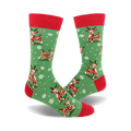 A pair of crew socks with a green background, red cuffs, and a pattern of brown reindeer and white snowflakes.