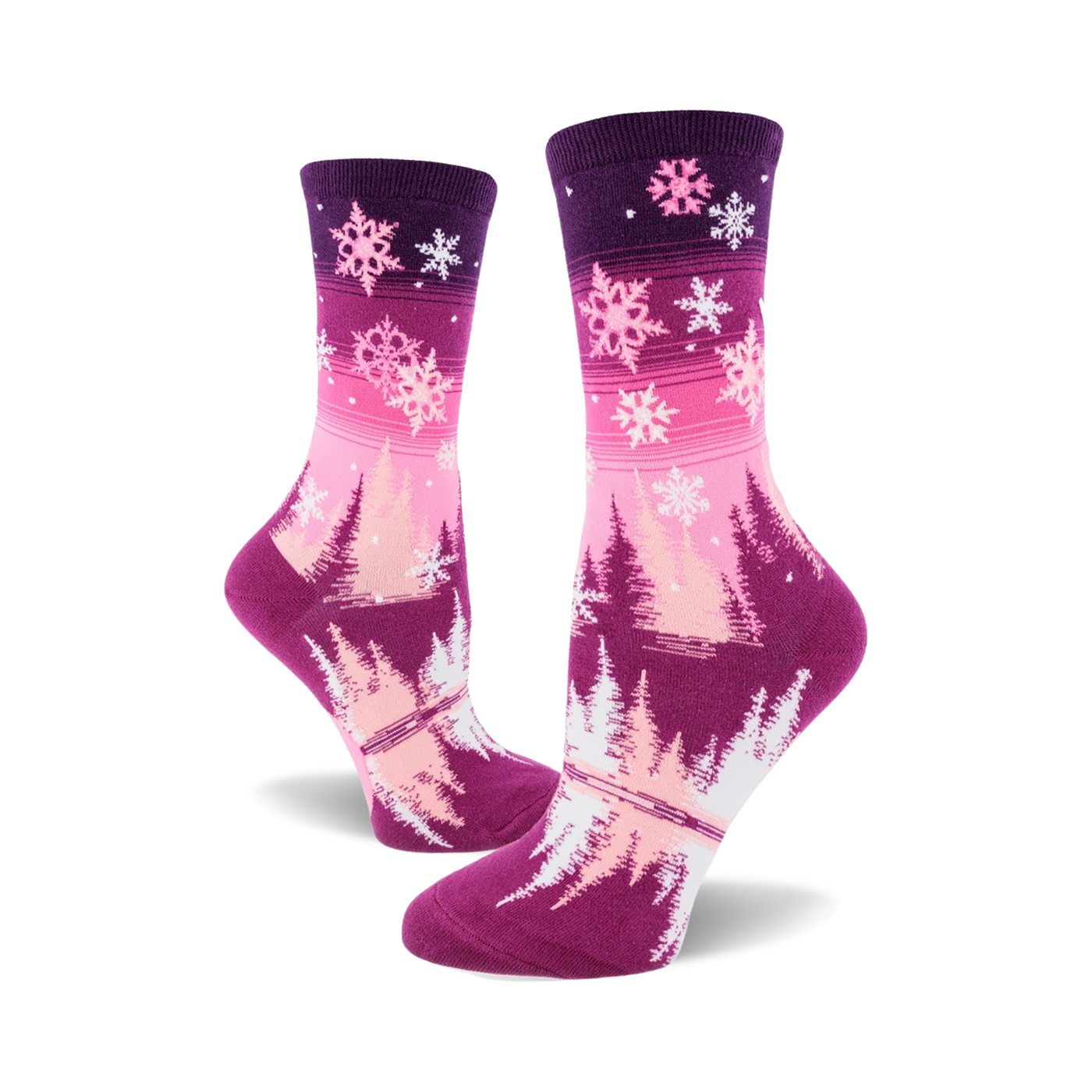 Women's crew socks in pink and purple ombre. Design features snowflakes and stylized winter trees.