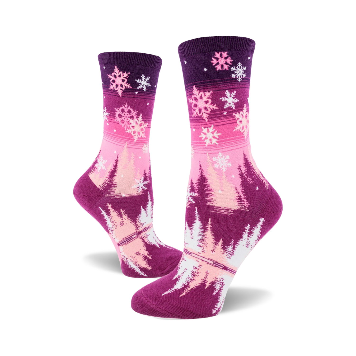 Women's crew socks in pink and purple ombre. Design features snowflakes and stylized winter trees.