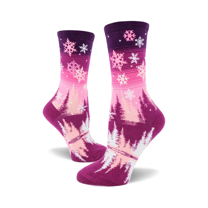 womens crew snowflake socks featuring a pink toe and heel with white snowflakes and green pine trees on a purple background.    }}