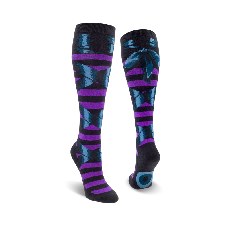 A pair of knee-high socks in purple and teal.  The socks feature a striped pattern and a dark teal bow design.