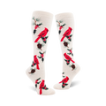 Pair of cream-colored knee-high socks with a repeating pattern of red cardinals, holly berries, and pine cones.