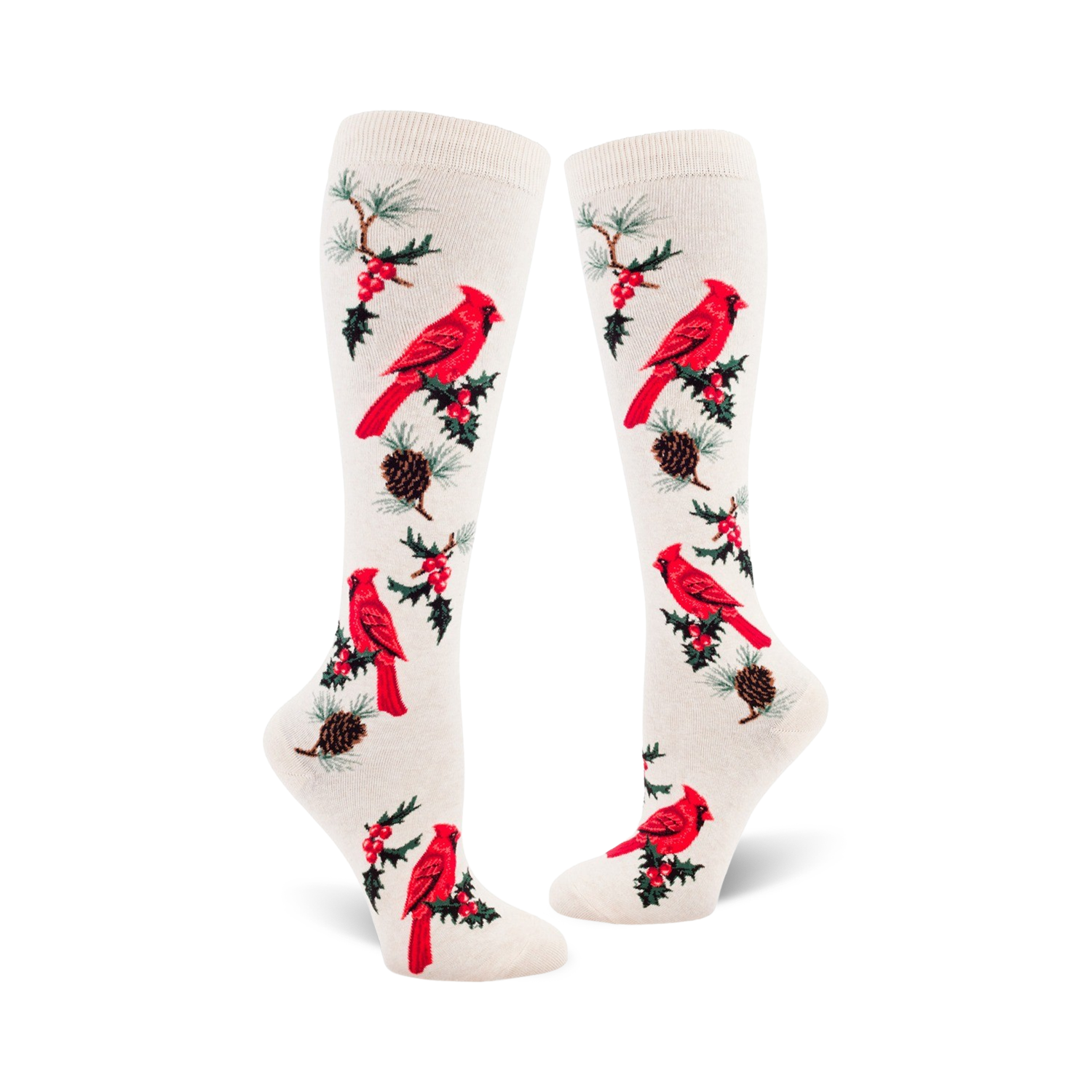 Pair of cream-colored knee-high socks with a repeating pattern of red cardinals, holly berries, and pine cones.