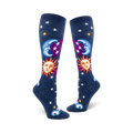 Pair of navy blue knee-high socks with whimsical sun, moon, and stars design.  Features smiling sun and moon faces, purple accents, and white stars.