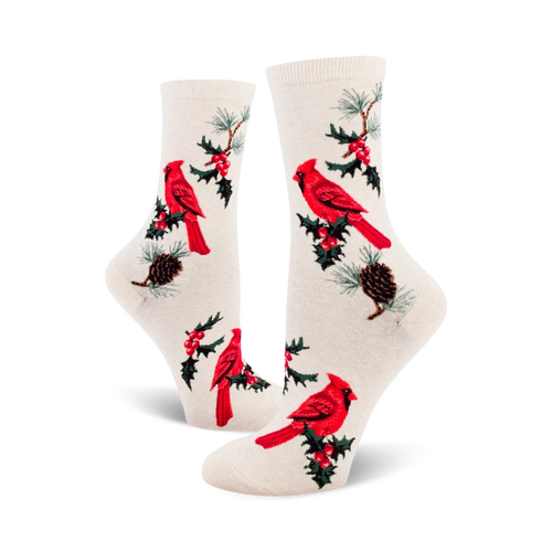 Cream crew socks with a pattern of red cardinals, holly sprigs, and pine cones.  A classic holiday design for cozy comfort.