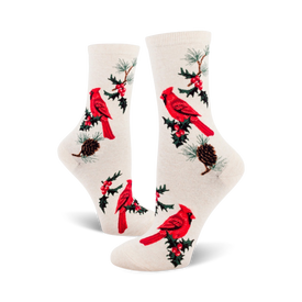 crew-length women's socks in white with a pattern of red cardinals, green pine boughs, and red berries.  