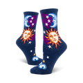 Pair of navy blue crew socks with whimsical sun, moon, stars, and clouds. The sun and moon have smiling faces.