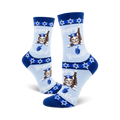 Crew socks in light blue, navy blue, and white.  The design features a repeating pattern of cats wearing yarmulkes and holding dreidels.  Text says 'Happy Hanukkah'.