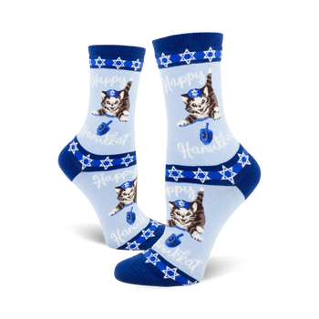 blue crew socks with star of david, menorah, and cartoon cat in yarmulke holding a dreidel.   