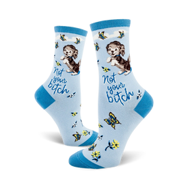  blue women's crew socks with cartoon dogs and flowers; the words 'not your bitch' on the ankle.   