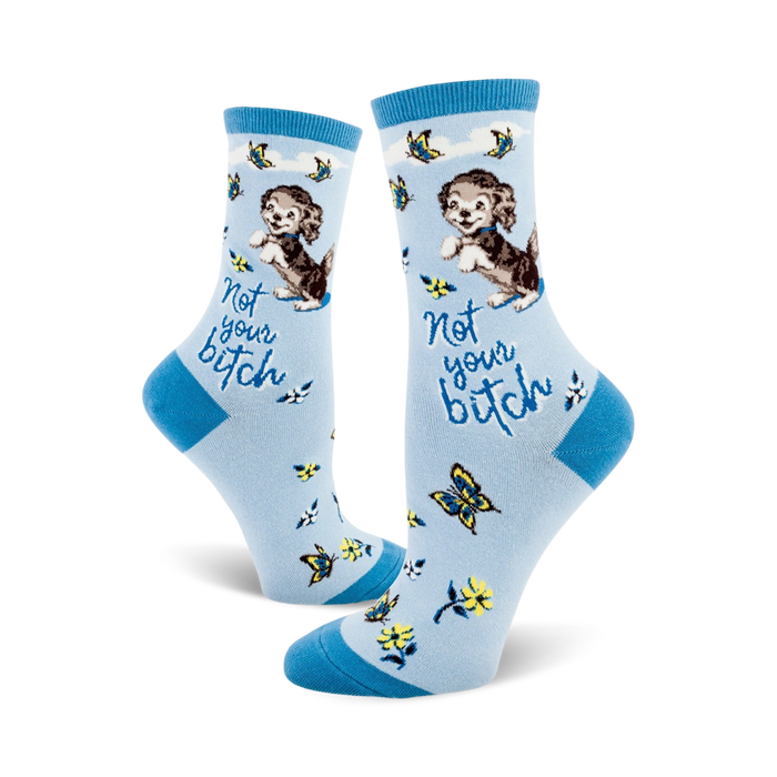   blue women's crew socks with cartoon dogs and flowers; the words 'not your bitch' on the ankle.    }}