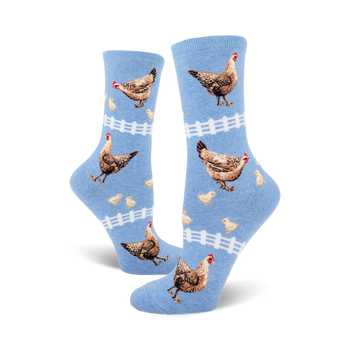 light blue crew socks for ladies feature brown, white, orange chicks and chickens with white picket fence design.  