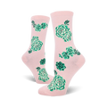 Lifestyle shot of the pink succulent socks on a model's feet.