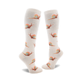 Pair of cream-colored knee-high socks adorned with a repeating pattern of brown snails leaving rainbow trails.