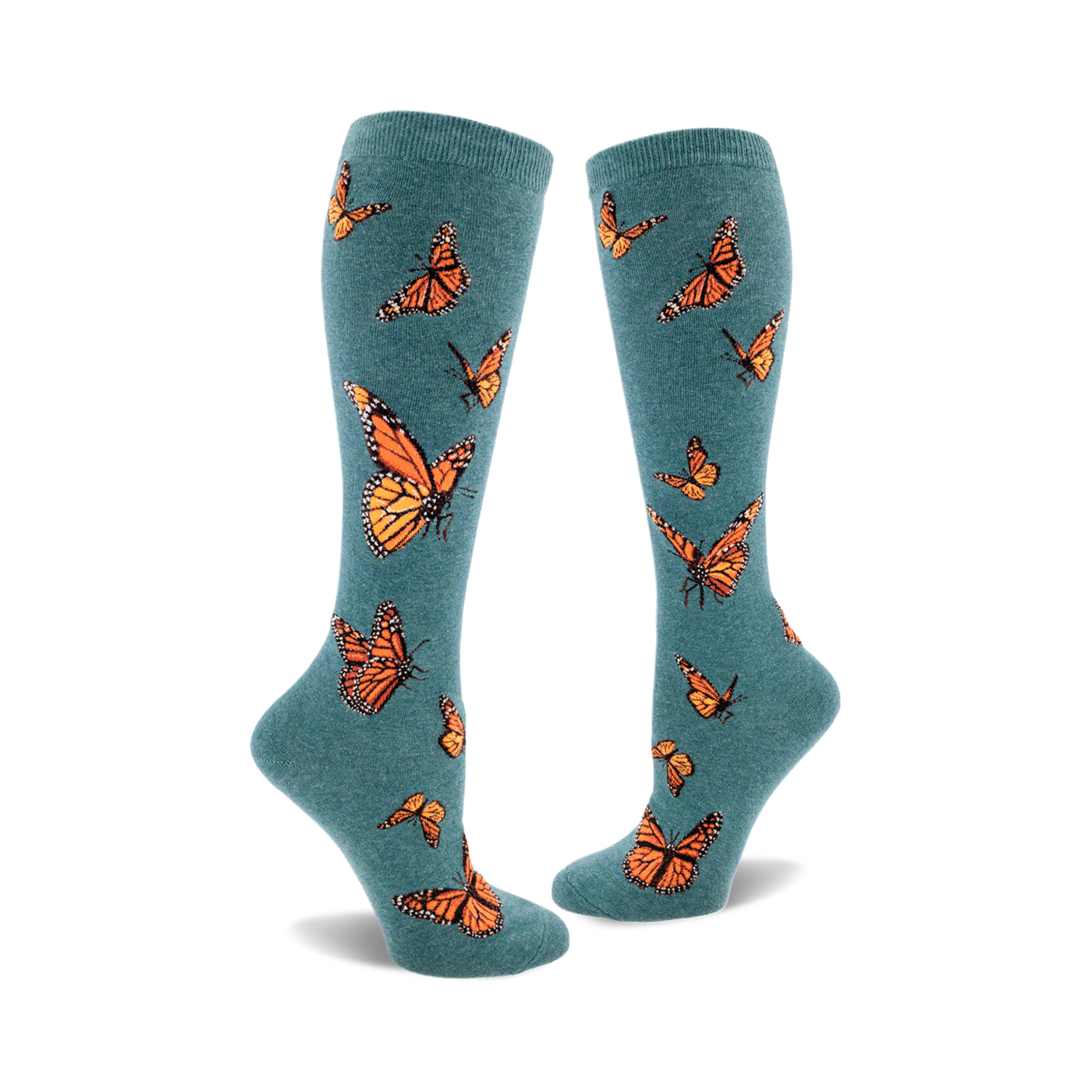 Pair of teal blue knee-high socks adorned with a pattern of orange monarch butterflies. Fun and stylish.