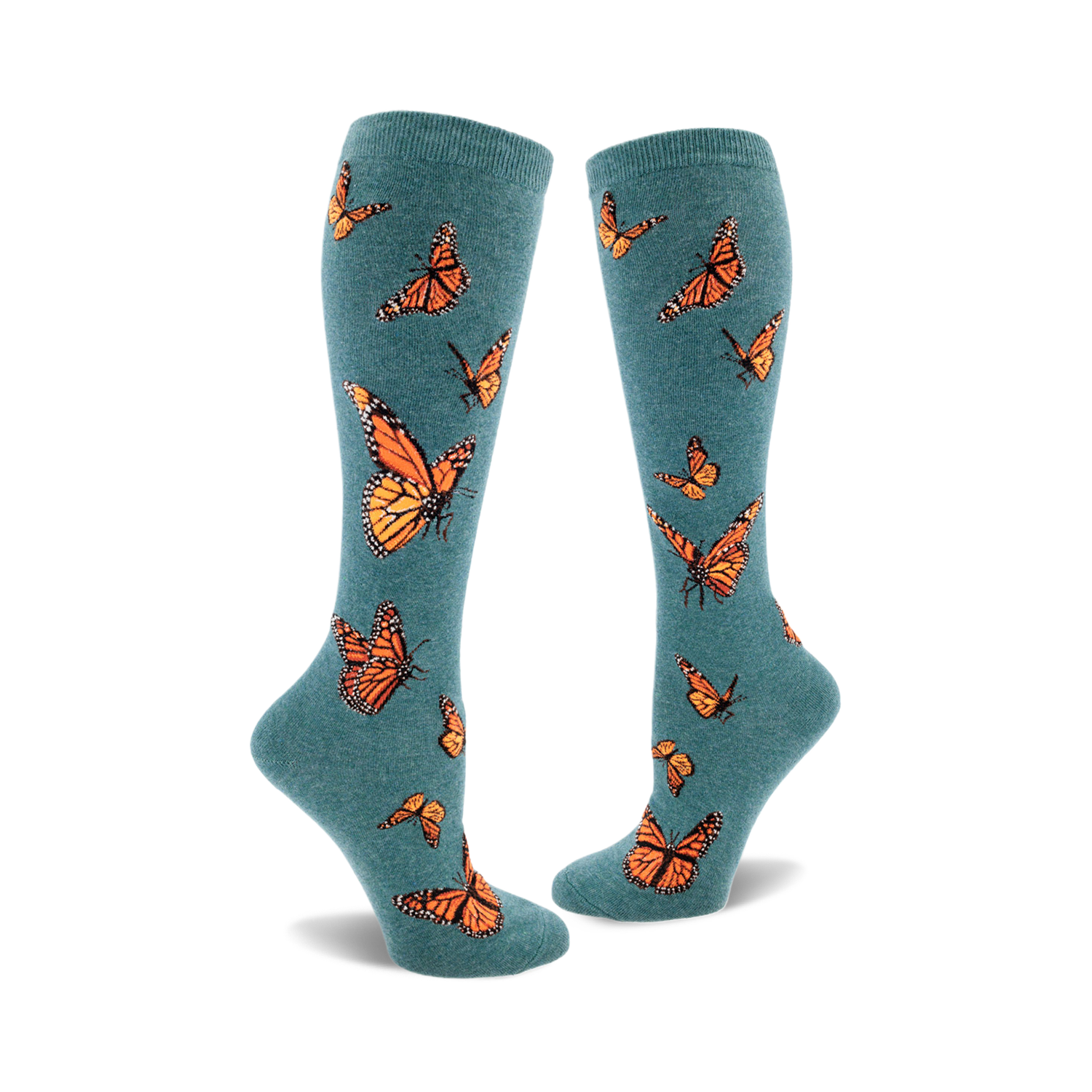 Pair of teal blue knee-high socks adorned with a pattern of orange monarch butterflies. Fun and stylish.