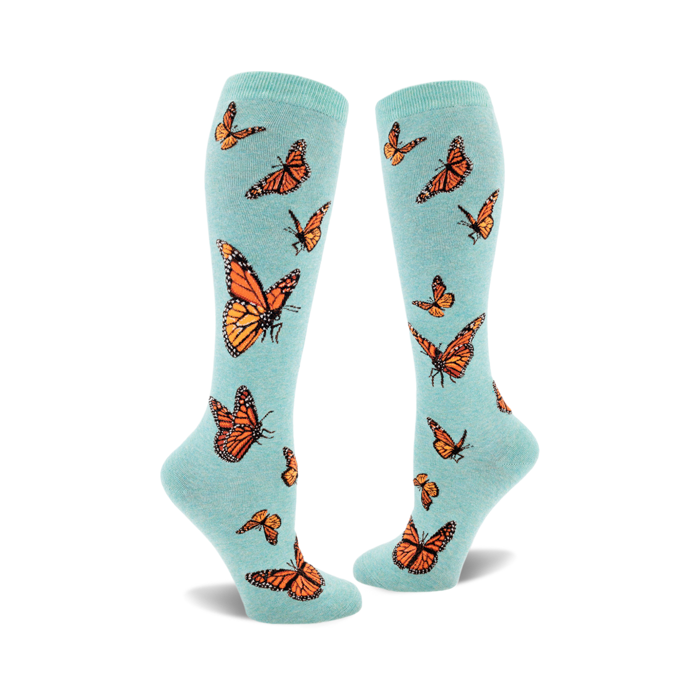 Pair of teal knee-high socks featuring an all-over print of orange monarch butterflies. 