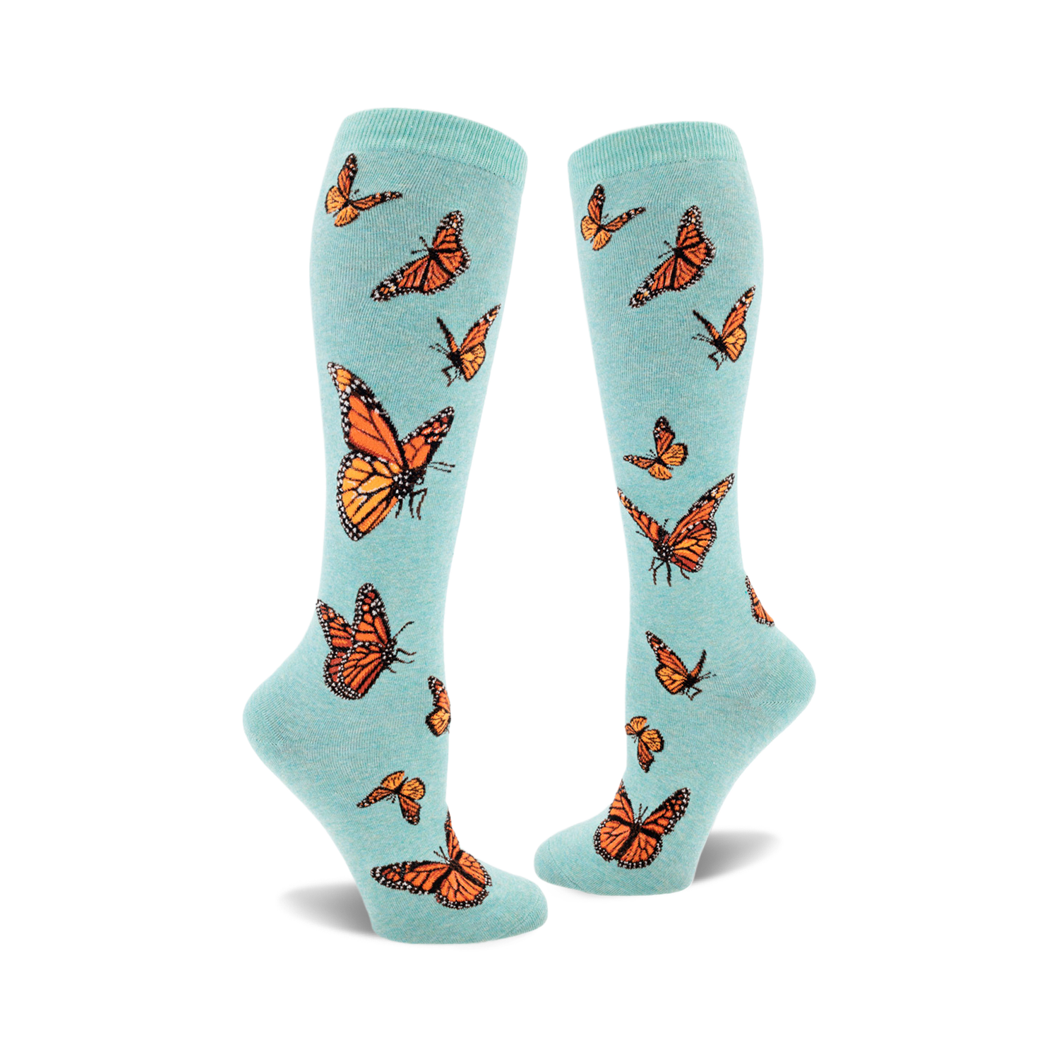 Pair of teal knee-high socks featuring an all-over print of orange monarch butterflies. 