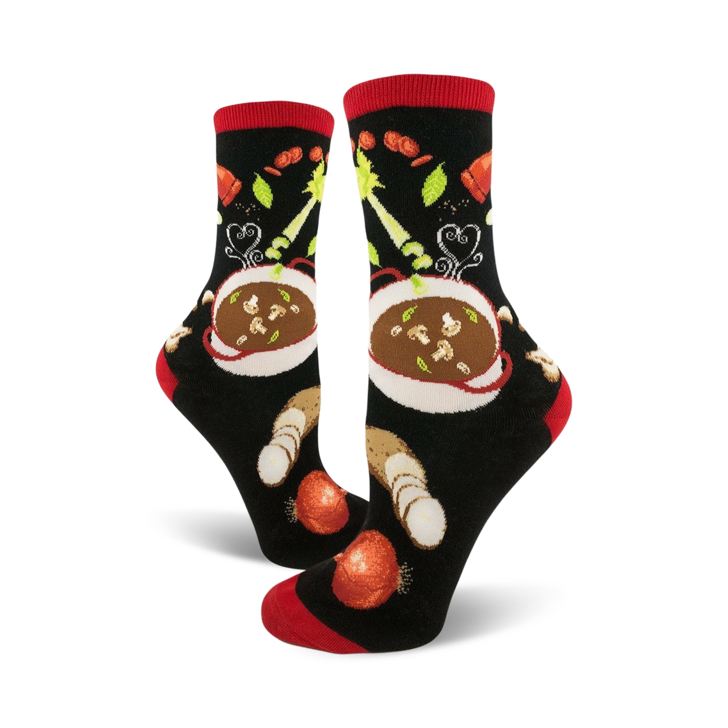 A pair of black crew socks with a red cuff, featuring a whimsical illustration of a bowl of soup and vegetables.