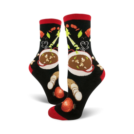black crew socks with red toe, heel, and cuff feature a pattern of red and white soup bowls with black handles, carrots, celery, and mushrooms.  