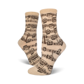 Close-up of beige crew socks with a musical notation print.  Dark brown notes on a beige background.