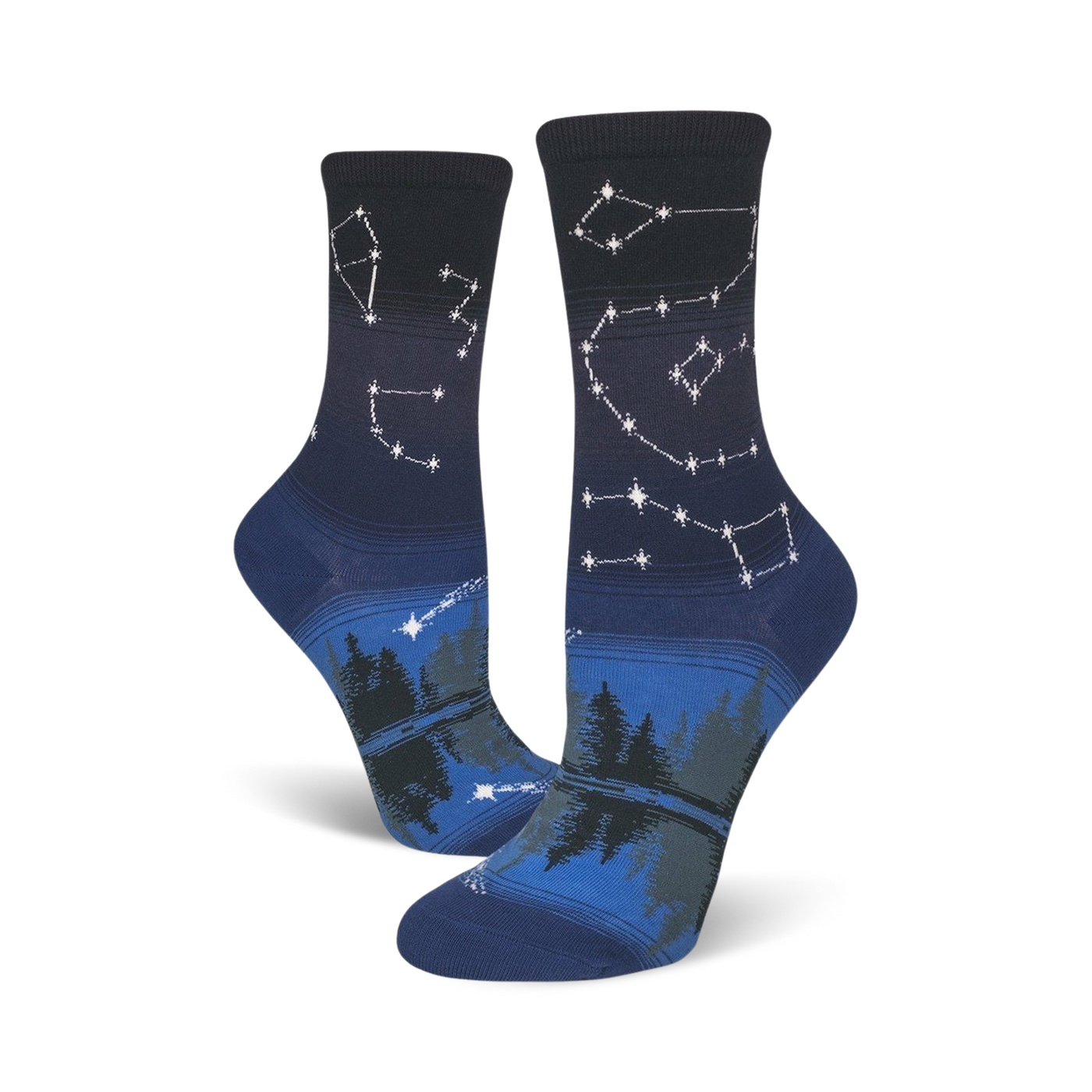 Pair of crew socks in navy blue and dark grey. Features a night sky design with constellations and a forest reflection.